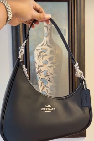 Coach Twisted Teri shoulder bag in black smooth leather.